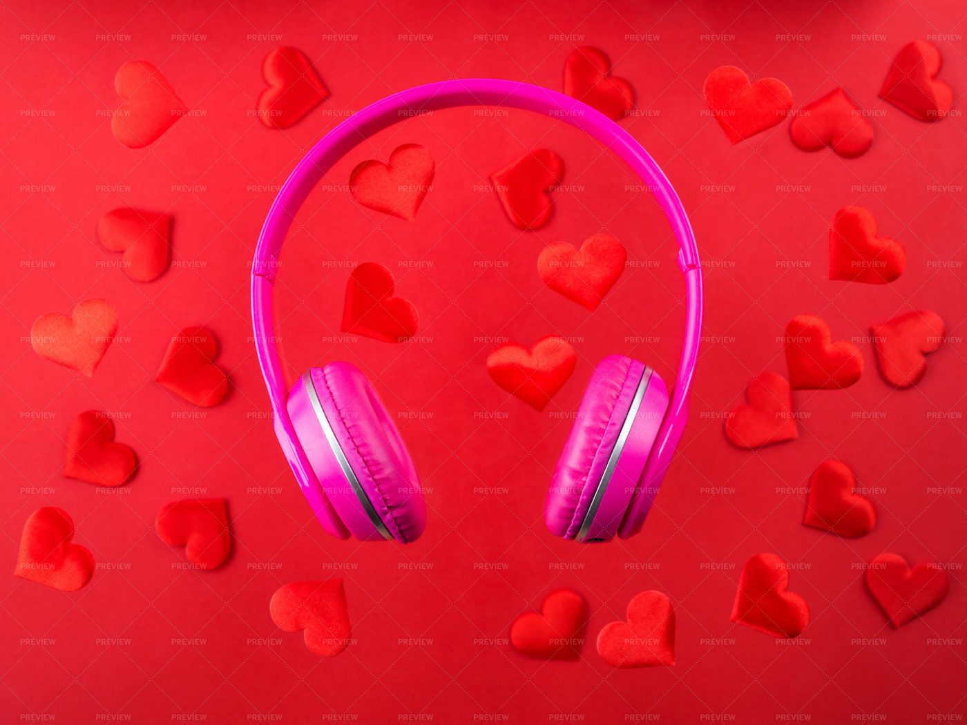 Pink Headphones On Red: Stock Photos