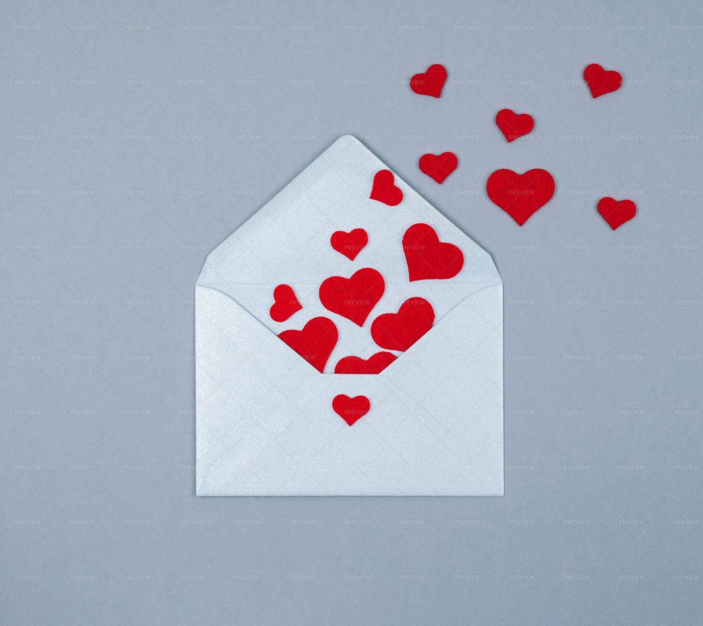 Hearts Flying From Silver Envelope: Stock Photos