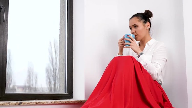Woman Sitting By The Window: Stock Video