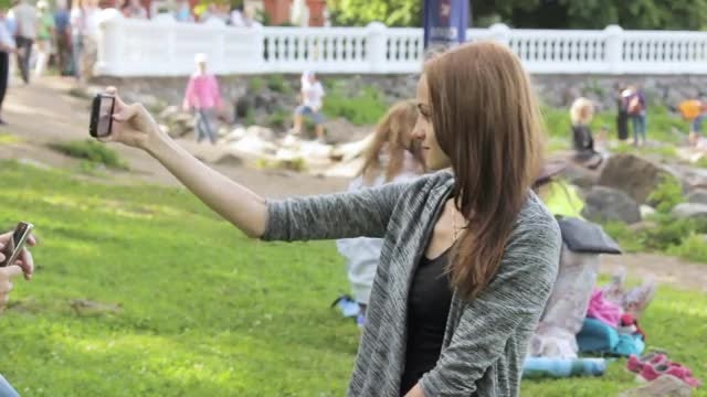 Girl Doing Selfies In Park: Stock Video