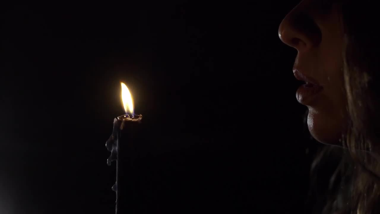 Woman Blows Out Candle Stock Video Motion Array