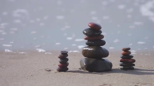 Smooth Stones On Beach Sand: Stock Video