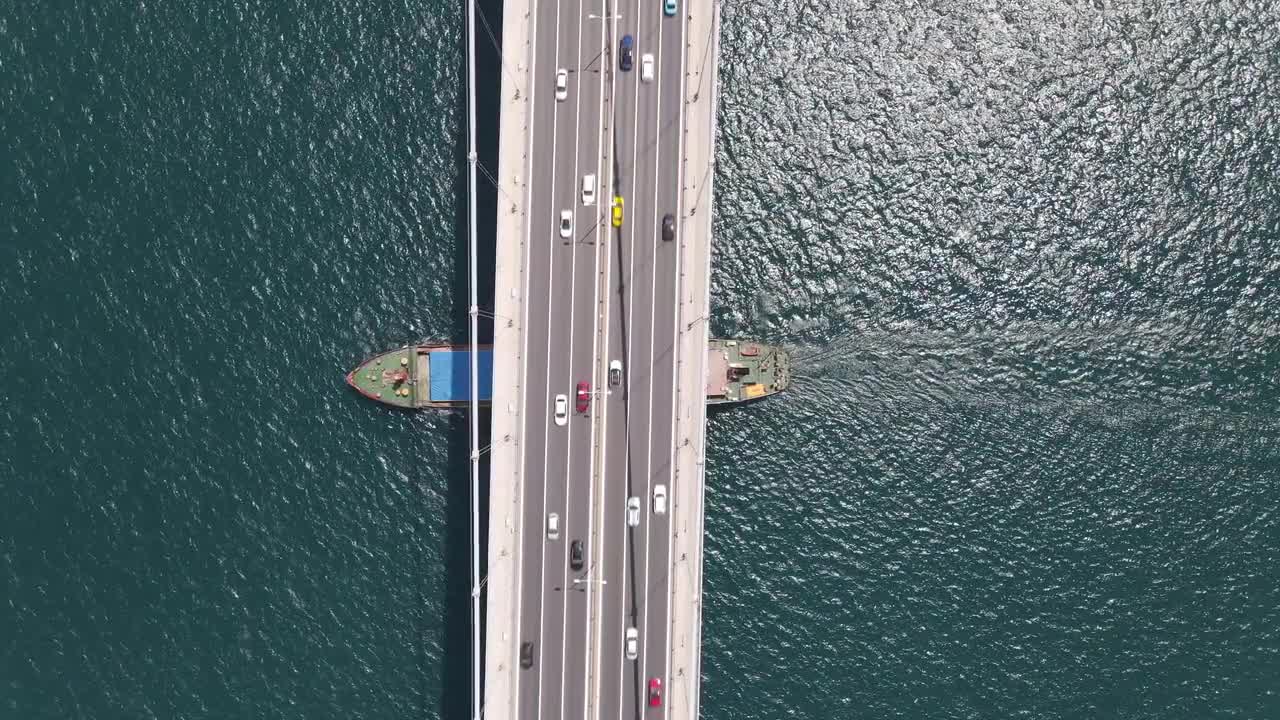 Cargo Ship Passing Under Bridge - Stock Video | Motion Array