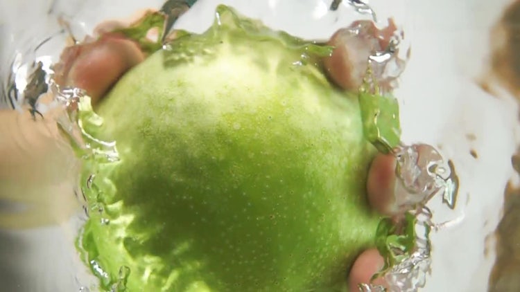Grabbing An Apple From Water: Stock Video