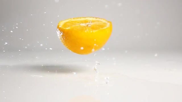 Orange Half Dropping Down: Stock Video