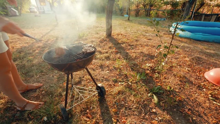 Barbecuing Outdoors In the Yard: Stock Video