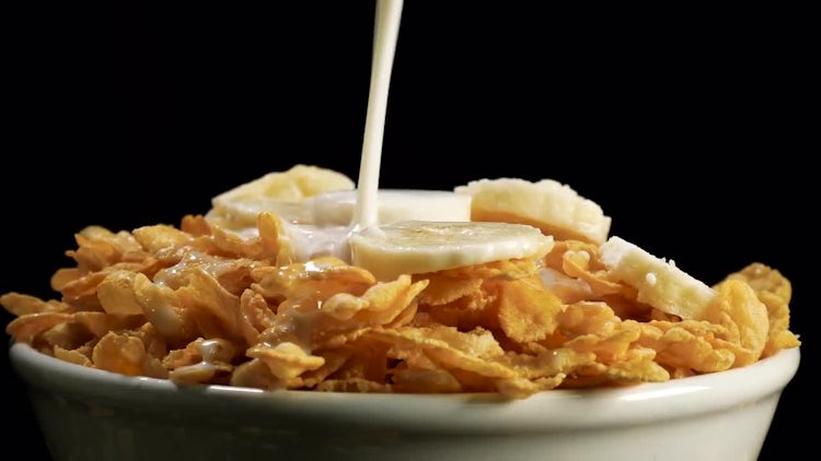 Adding Milk To Cornflakes Cereals: Stock Video