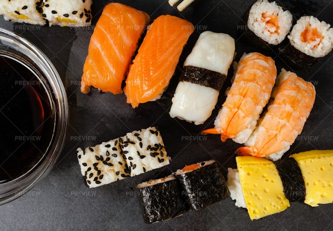 Assortment of Sushi Roll Set on a Black Tray. Japanese Food Stock