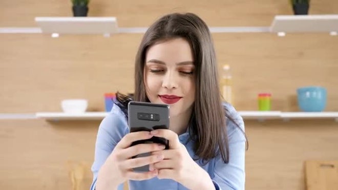 Woman Chatting On Her Smartphone - Stock Video | Motion Array