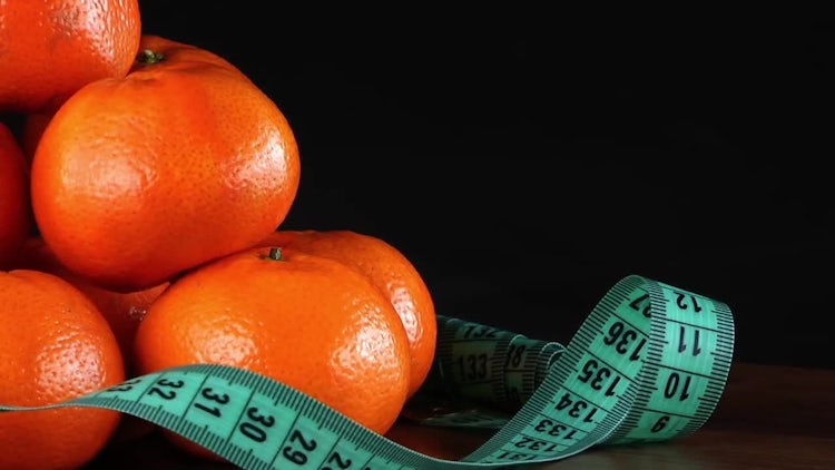 Mandarin Oranges With Measurement Tape: Stock Video