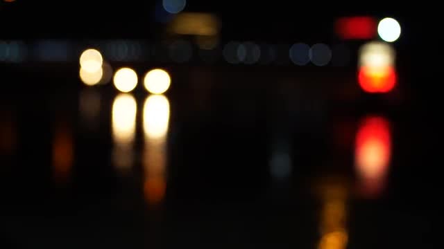 City Traffic Bokeh At Night: Stock Video