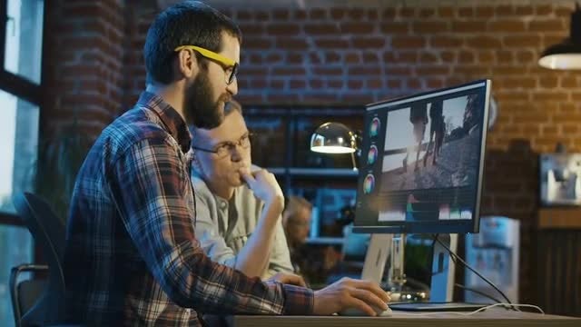 Two Men Editing A Video: Stock Video