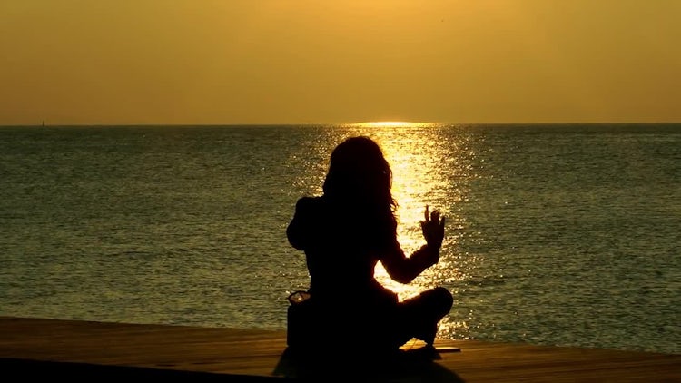 Woman Sitting On The Beach Watching the Sunset: Stock Video