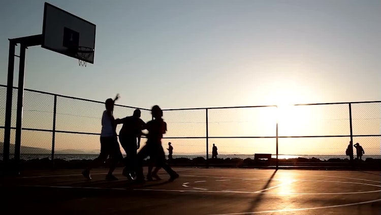 Silhouettes Of Men Playing Basketball: Stock Video