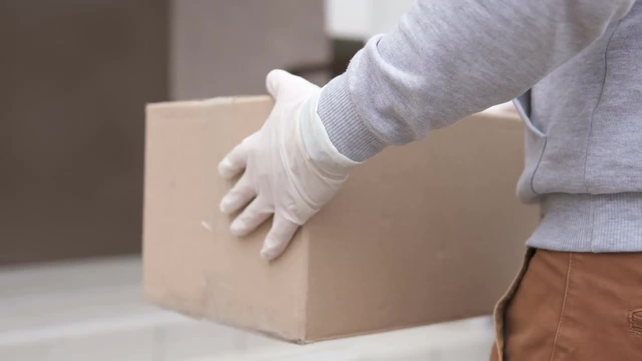 Courier Delivering A Parcel - Stock Video | Motion Array