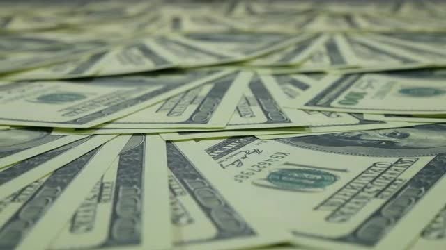 Panning Shot Of Dollar Bills: Stock Video