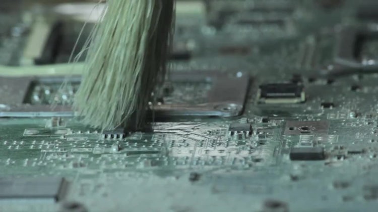 Dusting Off Laptop Motherboard: Stock Video