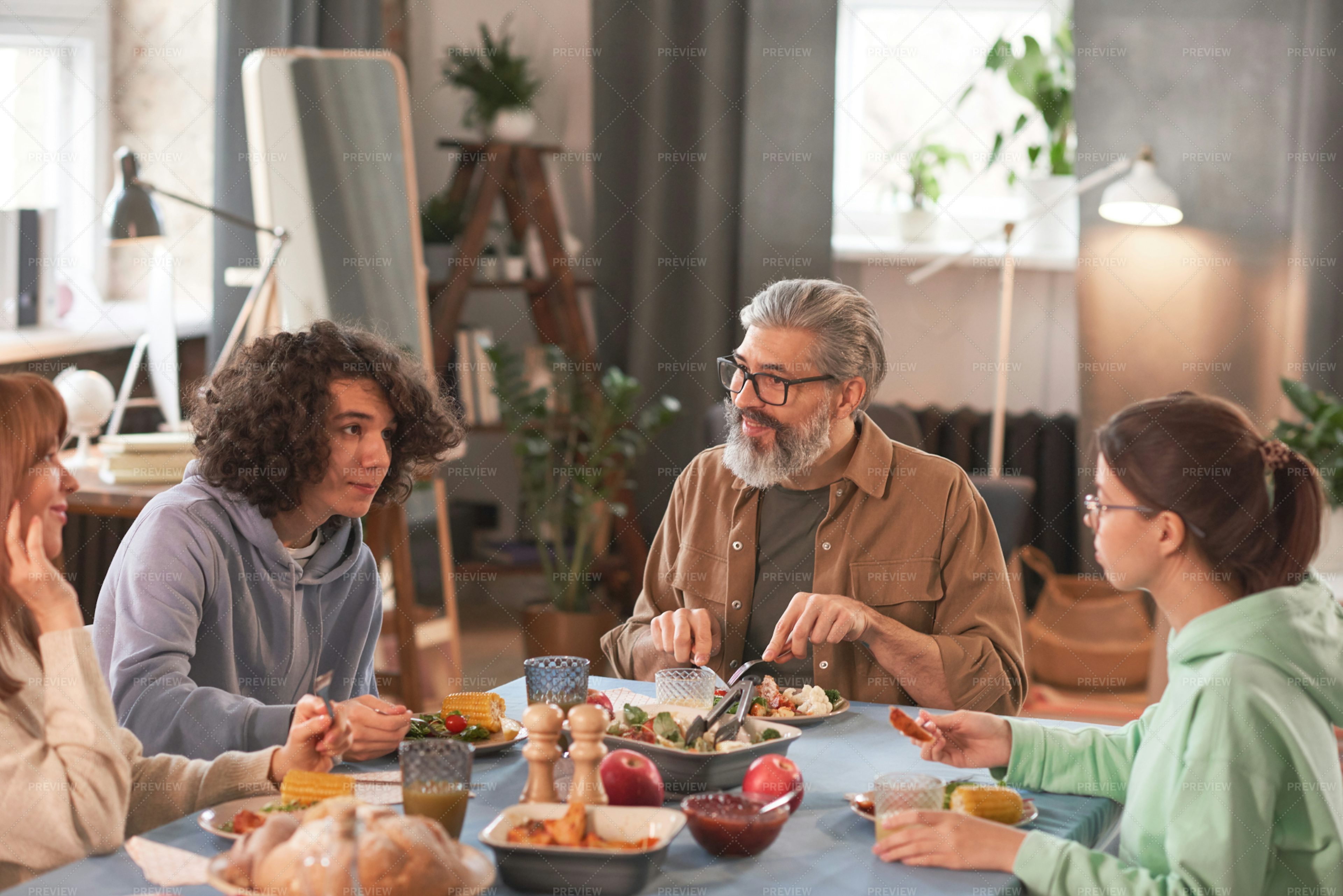 family-having-dinner-together-stock-photos-motion-array