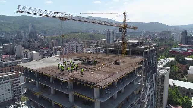 Tilting Shot Of Unfinished Building: Stock Video