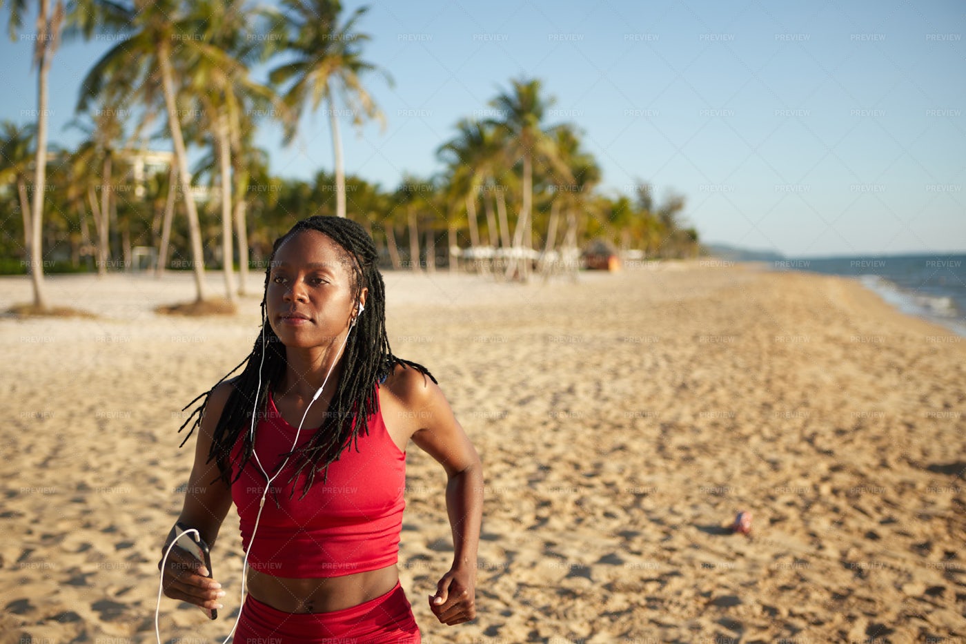 Woman Jogging At The Beach: Stock Photos