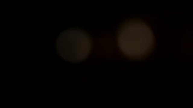 Lights On Blurred Black Background: Stock Video