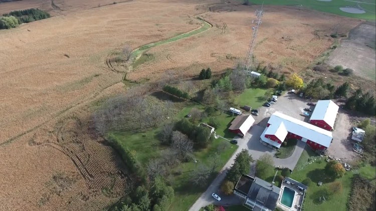 Red Farmhouse In Wheat Field : Stock Video