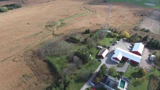 Red Farmhouse In Wheat Field : Stock Video