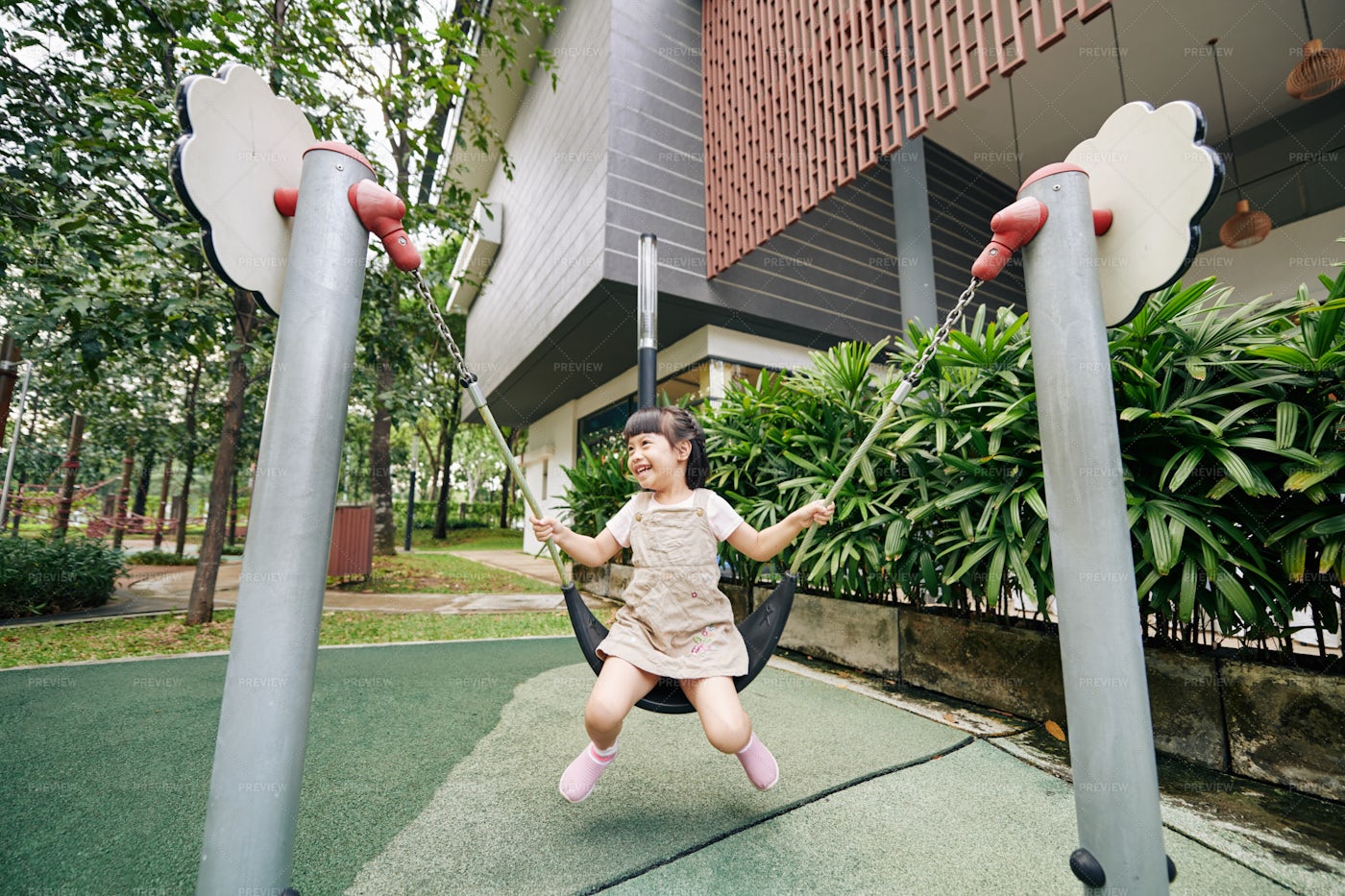 Girl Swinging On Playground: Stock Photos