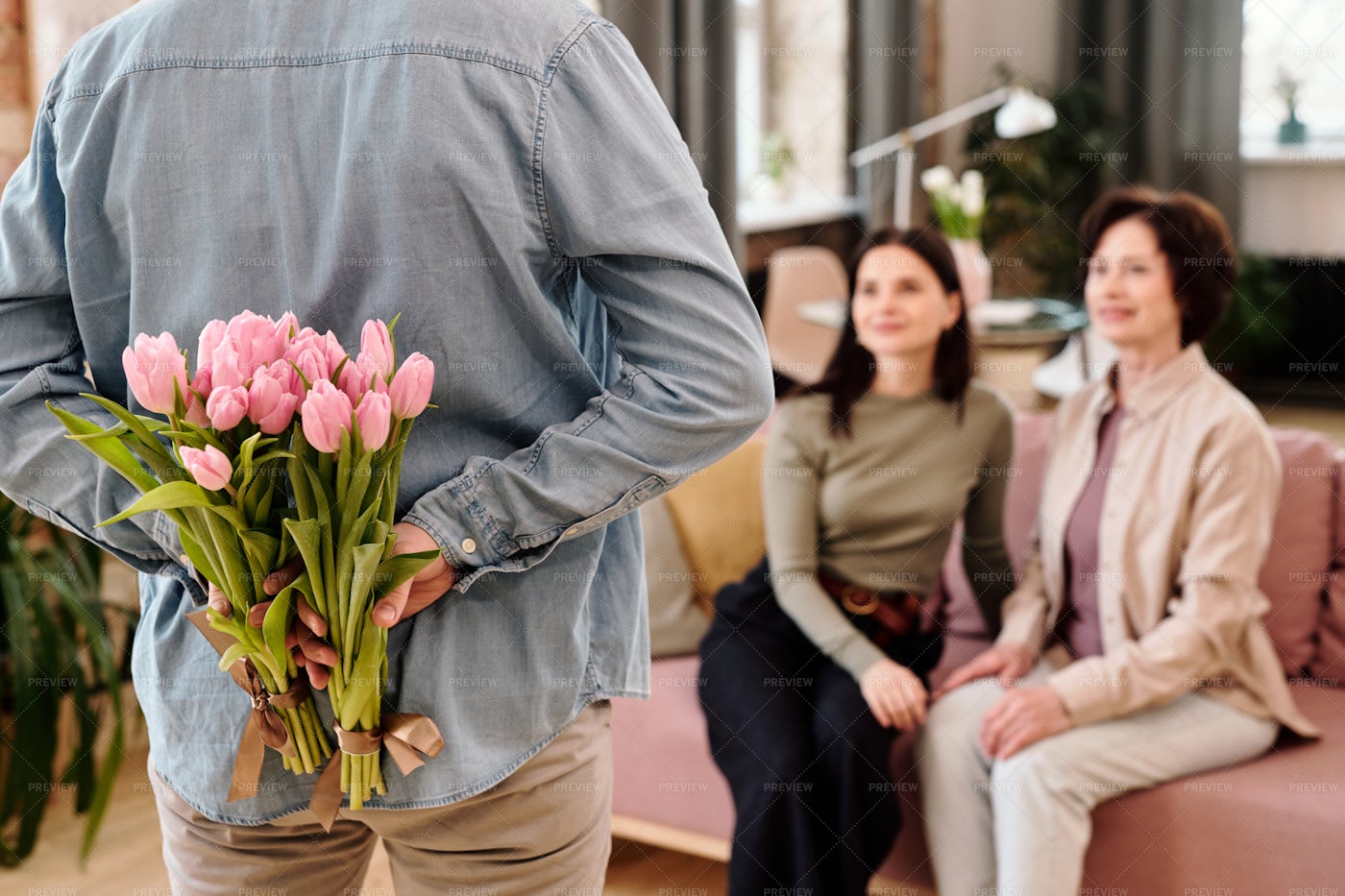 Man Giving Flowers To Females: Stock Photos