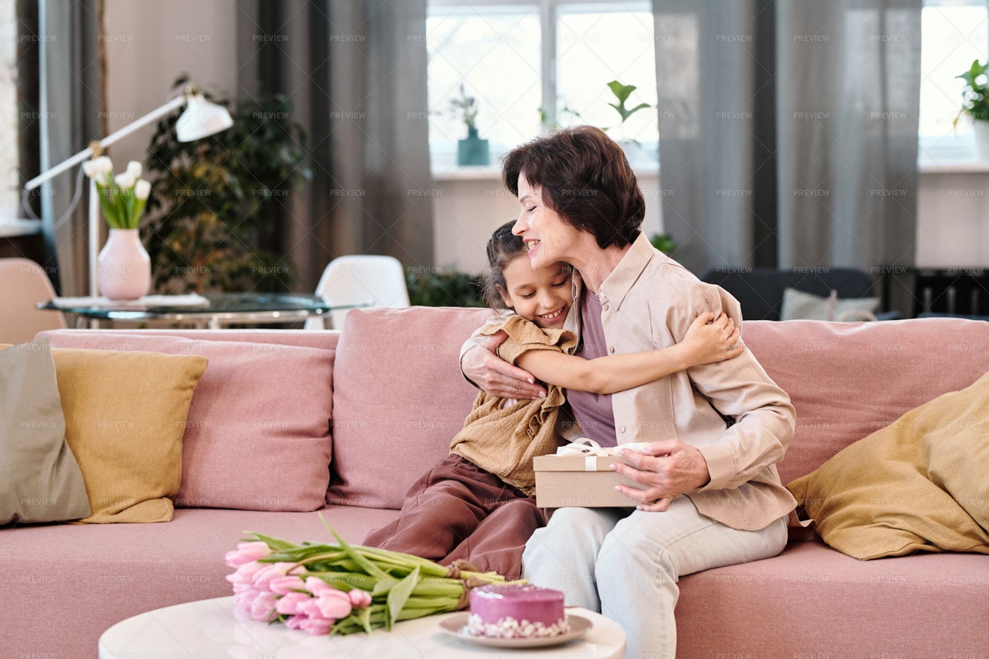 Little Girl Embracing Grandmother: Stock Photos