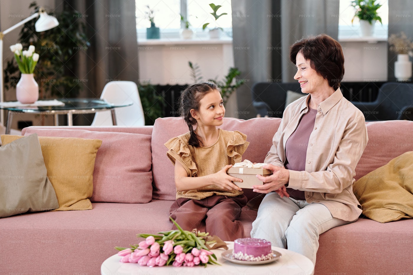 Happy Little Girl Looking At Grandmother: Stock Photos