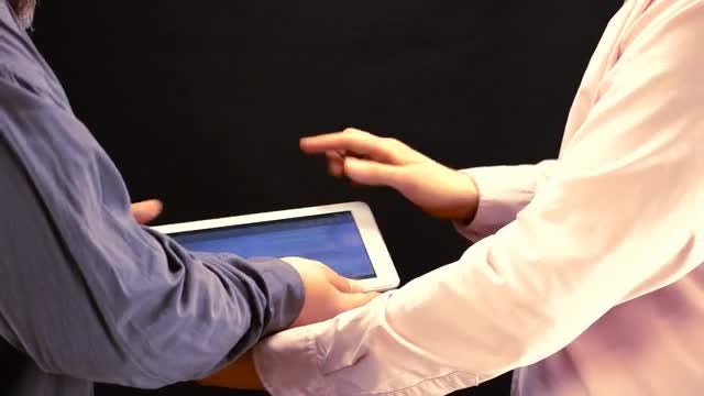 Tablet Sharing Among Work Colleagues : Stock Video