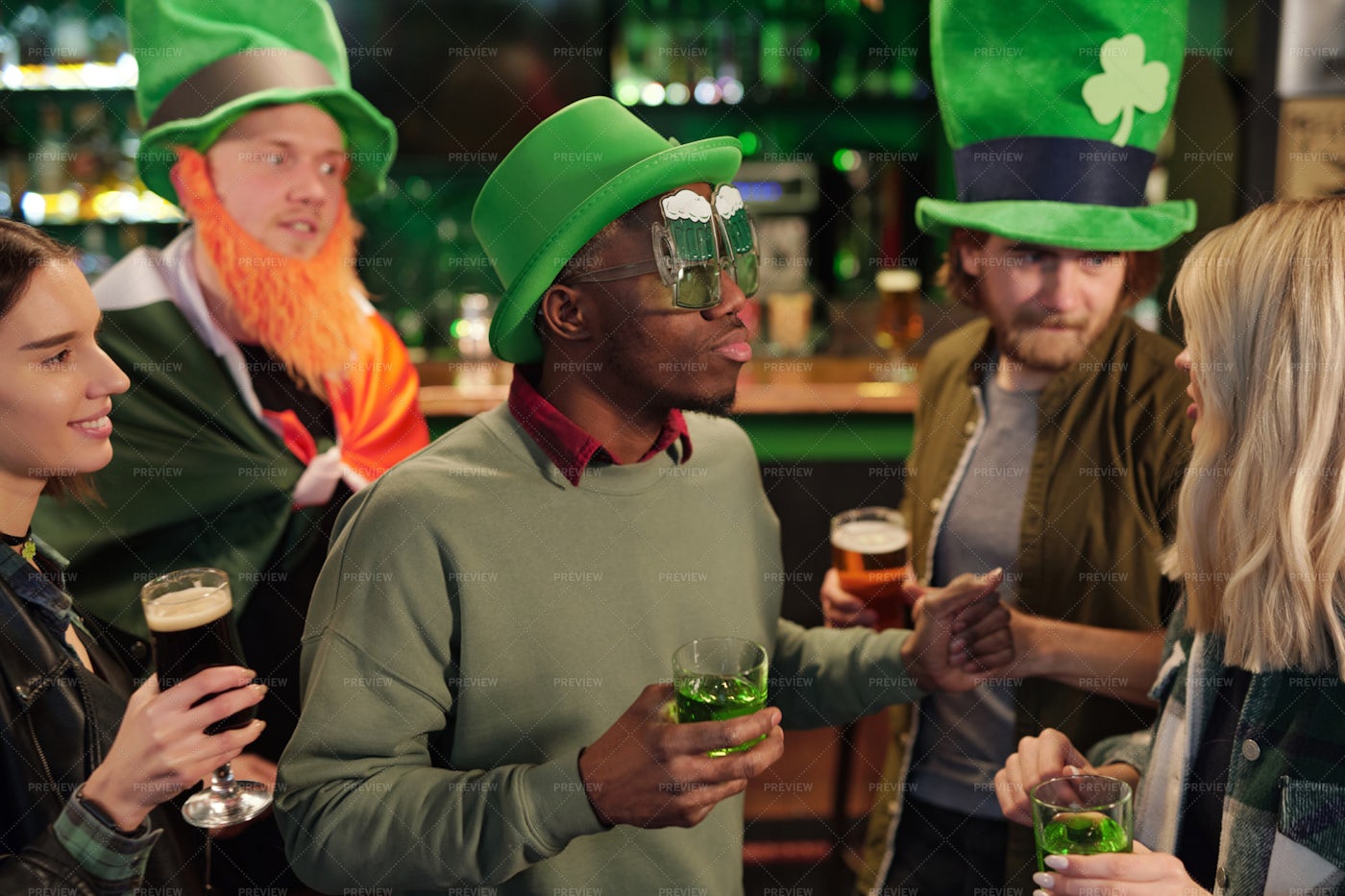 People Drinking Cocktails In The Pub: Stock Photos