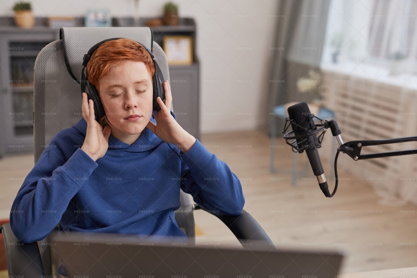 Boy Listening To Music In Headphones: Stock Photos