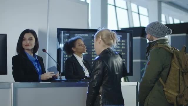airport security personnel processing passengers stock video