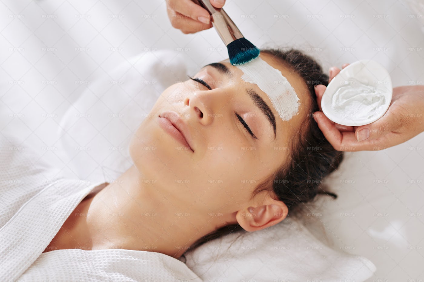 Woman Getting Moisturizing Mask: Stock Photos