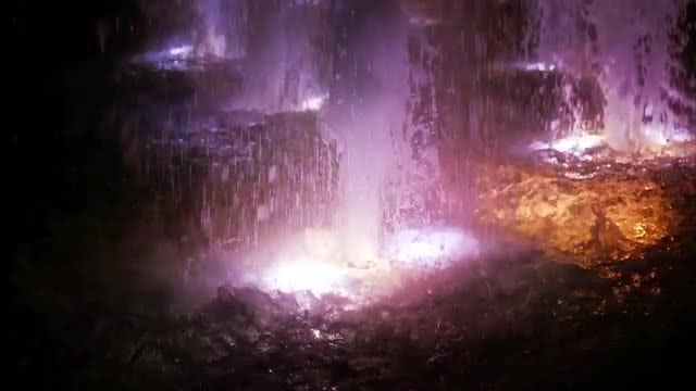 Colored Outdoor Fountain Splashing Water: Stock Video