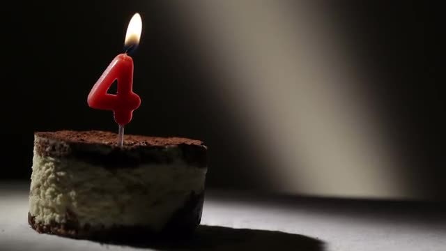 Candle Four in Tiramisu Cake: Stock Video