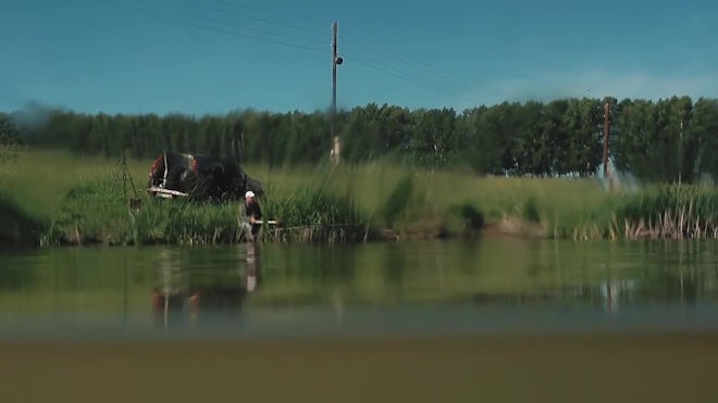 Fisherman Watches Fishing Rod Float Pulls Rod River Water Caught Fish -  Stock Video