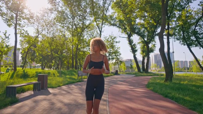 Teenage Girls running in park exercising, Stock Video