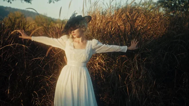 Woman In Field. Nostalgic Scene With Woman In Flowing White Dress Amid Tall Gold by Chero - Stock Video | Motion Array Woman In Field. Nostalgic Scene With Woman In Flowing White Dress Amid Tall Gold by Chero - Stock Video | Motion Array