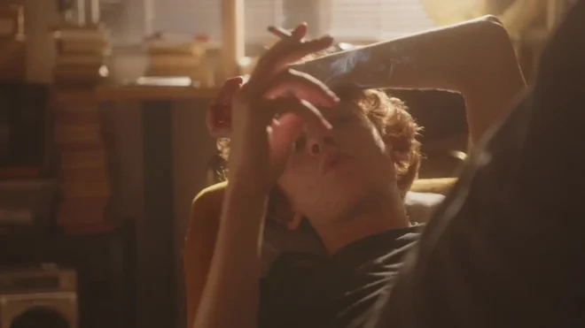 Young Sad Man In Depression Resting On Couch And Smoking Cigarette by YUKI  FILM - Stock Video